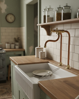 Unlacquered brass and copper kitchen faucet