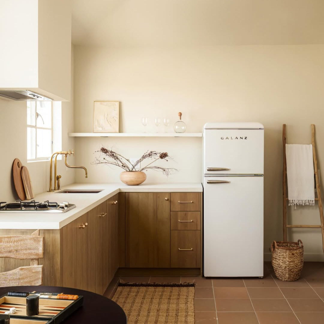 aged unlacquered brass kitchen faucet