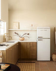 aged unlacquered brass kitchen faucet