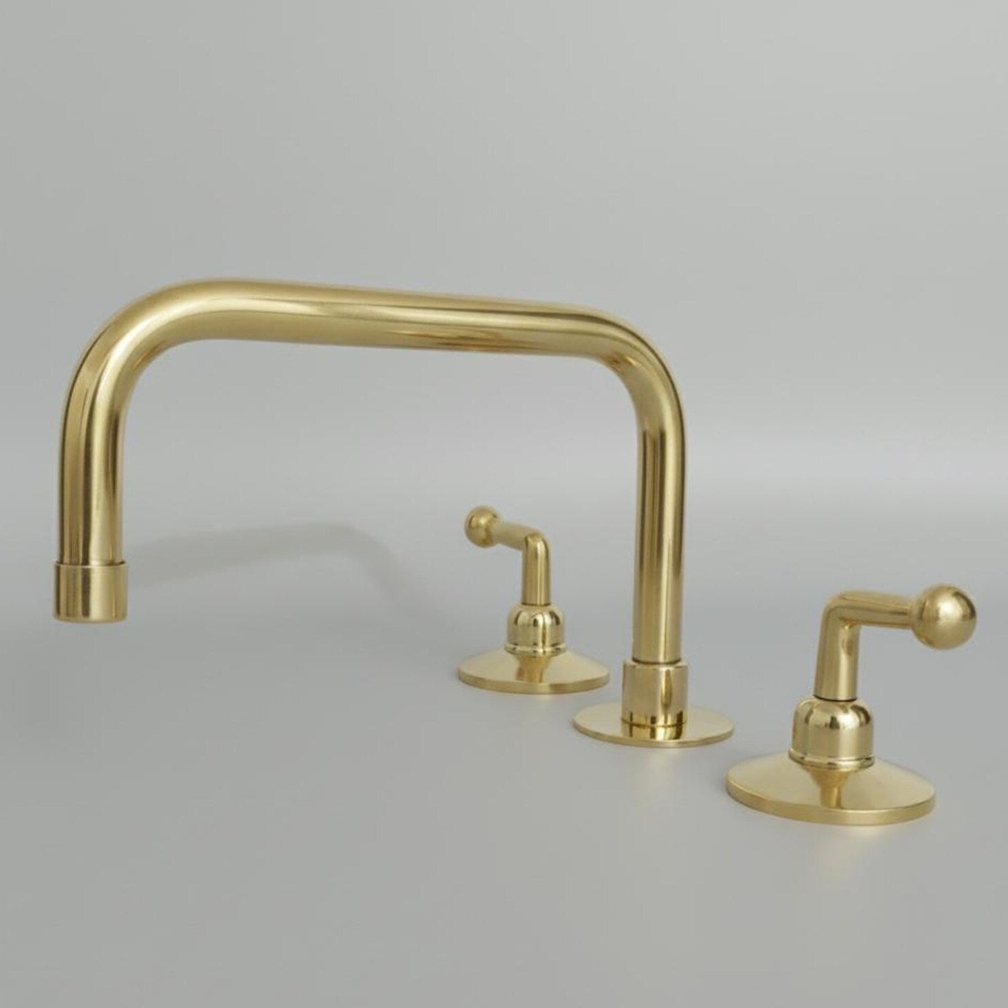 Gold brass bathroom faucet with lever handles