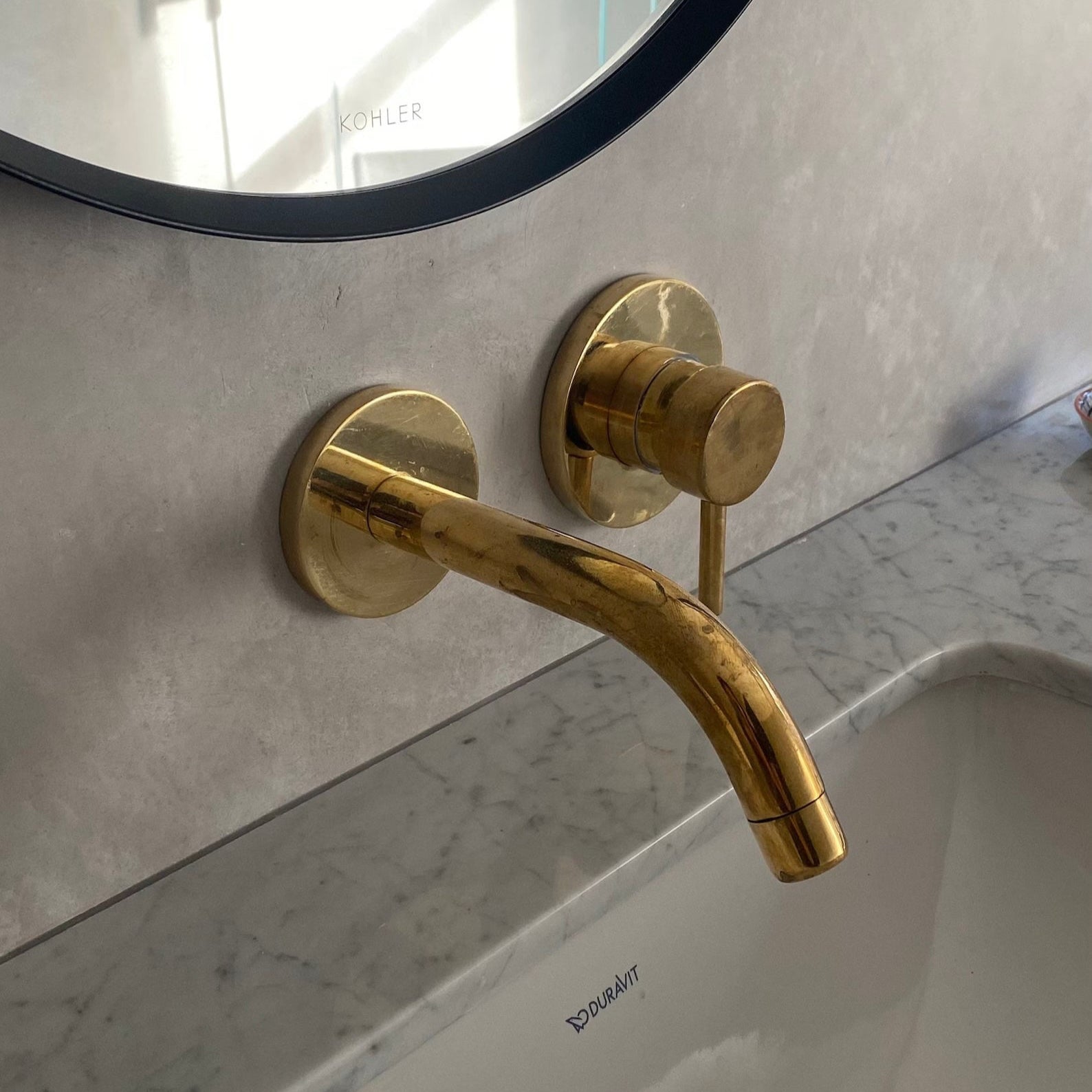 Unlacquered brass single handle wall mounted faucet